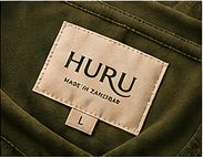 HURU woven label inside a deep green T-shirt